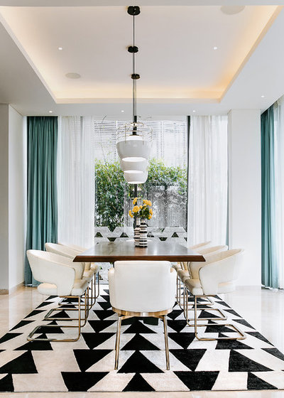 Contemporary Dining Room by Naarkaali Design Studio