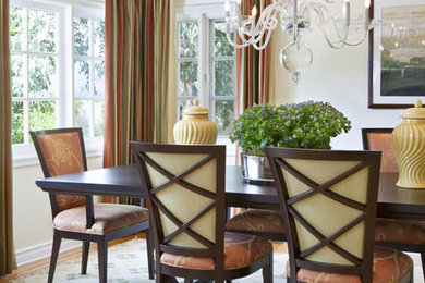 Example of a classic dining room design in Los Angeles with beige walls