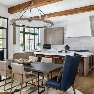 Inspiration for a contemporary medium tone wood floor great room remodel in Austin with white walls and no fireplace