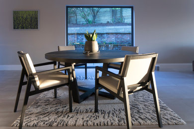 This is an example of a contemporary dining room in Manchester.