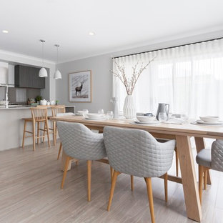 Design ideas for a scandinavian kitchen/dining combo in Melbourne with grey walls, light hardwood floors and beige floor.