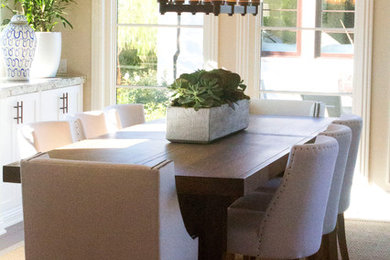 Example of a mid-sized transitional kitchen/dining room combo design in San Diego with beige walls