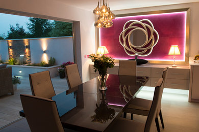 This is an example of a contemporary dining room in Kent.