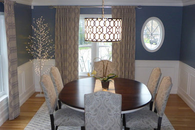 Transitional light wood floor dining room photo in Boston with blue walls