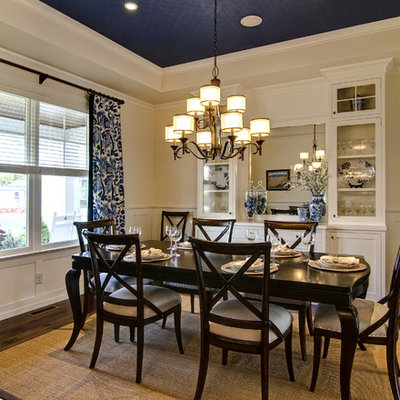 Dining room - traditional dark wood floor dining room idea in Other with beige walls