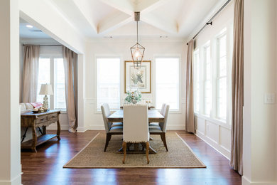 Inspiration for a transitional medium tone wood floor and brown floor dining room remodel in Atlanta with white walls