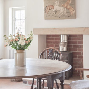 This is an example of a medium sized rural open plan dining room in West Midlands.