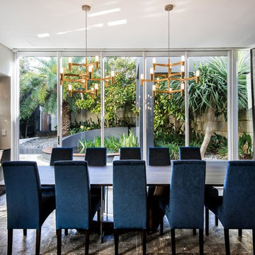 Feature brass pendant lights above dining room
