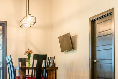 Example of a transitional dining room design in Denver