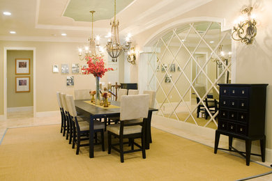 Example of a huge transitional travertine floor enclosed dining room design in Orlando with beige walls and no fireplace