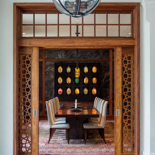 Inspiration for an asian medium tone wood floor and brown floor enclosed dining room remodel in New York with gray walls