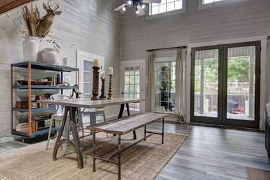 Great room - mid-sized cottage medium tone wood floor and gray floor great room idea in Austin with gray walls and no fireplace