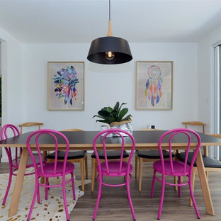 Design ideas for a beach style dining room in Sydney with white walls, dark hardwood floors and brown floor.