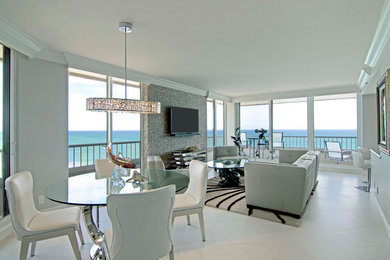 Photo of a medium sized contemporary kitchen/dining room in Miami with beige walls, porcelain flooring and no fireplace.