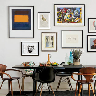 Ispirazione per una piccola sala da pranzo design con pareti grigie e pavimento in pietra calcarea