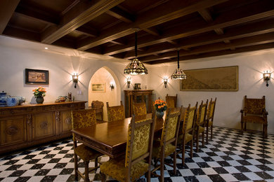 Tuscan dining room photo in Santa Barbara with white walls