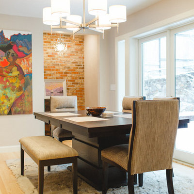 Enclosed dining room - large contemporary light wood floor enclosed dining room idea in Salt Lake City with beige walls and no fireplace