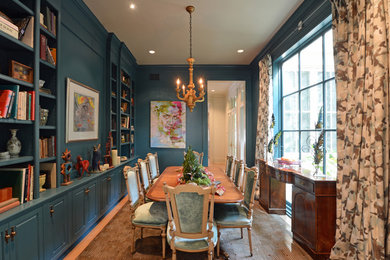 Enclosed dining room - mid-sized victorian light wood floor enclosed dining room idea in New Orleans with blue walls and no fireplace