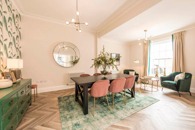 Example of an eclectic vinyl floor dining room design in Dorset with white walls