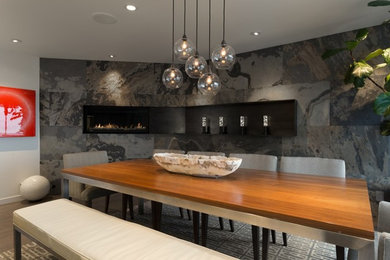 Kitchen/dining room combo - large contemporary medium tone wood floor kitchen/dining room combo idea in San Francisco with white walls, a ribbon fireplace and a tile fireplace