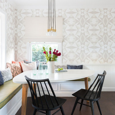 Example of a small beach style dark wood floor and brown floor dining room design in Los Angeles with multicolored walls