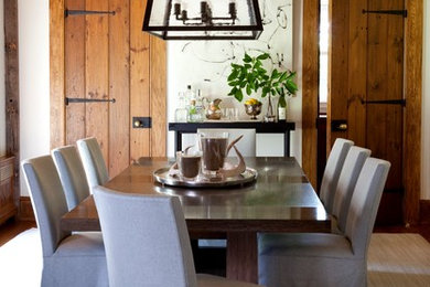 Inspiration for a farmhouse enclosed dining room remodel in New York with white walls