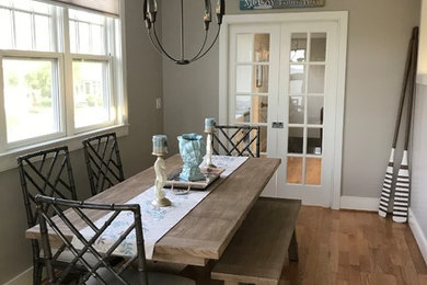 Example of a beach style dining room design in Other