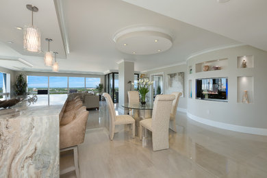Inspiration for a contemporary dining room remodel in Miami with beige walls