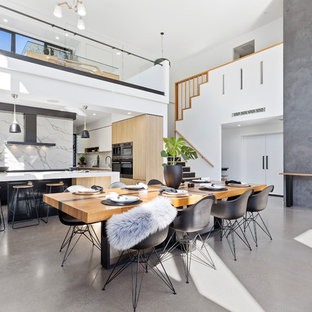 Design ideas for a contemporary open plan dining in Brisbane with concrete floors, grey floor and grey walls.