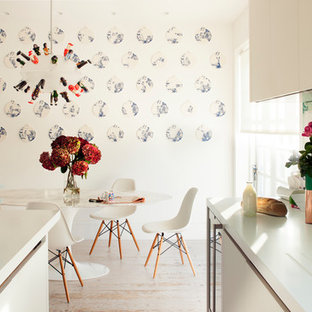 Photo of a medium sized contemporary kitchen/dining room in London with painted wood flooring and white floors.