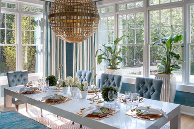 Inspiration for a large transitional light wood floor enclosed dining room remodel in New York with blue walls and no fireplace