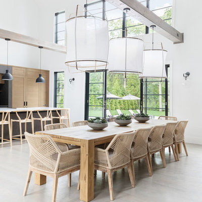 Mid-sized beach style dark wood floor and gray floor kitchen/dining room combo photo in New York with white walls