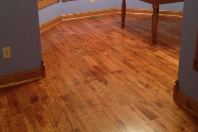 Large medium tone wood floor dining room photo in Minneapolis
