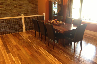 Dining room - large rustic medium tone wood floor dining room idea in St Louis with red walls and no fireplace
