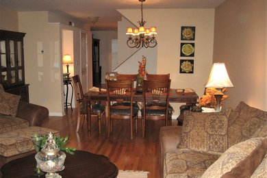 Photo of a medium sized classic enclosed dining room in New York with beige walls, medium hardwood flooring, no fireplace and beige floors.