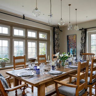 Design ideas for a medium sized farmhouse dining room in Other with beige walls and beige floors.