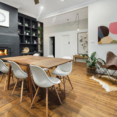Kitchen/dining room combo - mid-sized contemporary medium tone wood floor kitchen/dining room combo idea in Melbourne with white walls