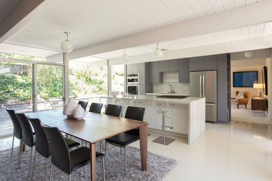 Inspiration for a mid-sized mid-century modern marble floor and white floor kitchen/dining room combo remodel in San Francisco with gray walls and no fireplace