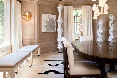 This is an example of a large contemporary enclosed dining room in San Francisco with beige walls, light hardwood flooring, no fireplace and beige floors.