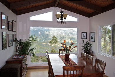 Example of a mid-sized mountain style bamboo floor great room design in San Diego with white walls