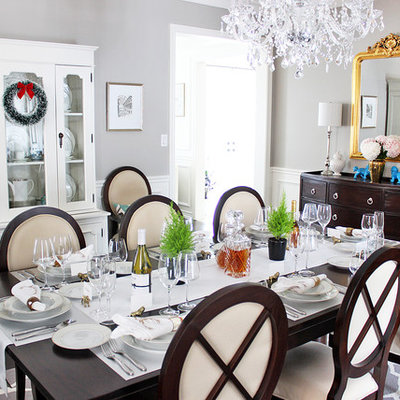 Inspiration for a transitional dark wood floor enclosed dining room remodel in Toronto with gray walls
