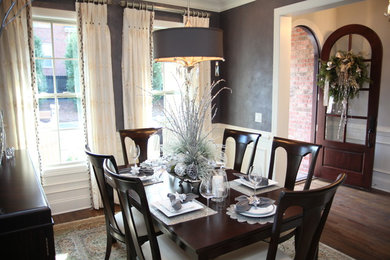 Enclosed dining room - small traditional light wood floor enclosed dining room idea in Charleston with no fireplace and gray walls