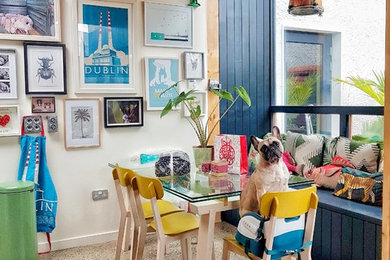 Photo of a medium sized eclectic dining room in Other with white walls.