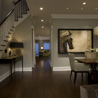 Elegant dark wood floor and brown floor dining room photo in Chicago with gray walls