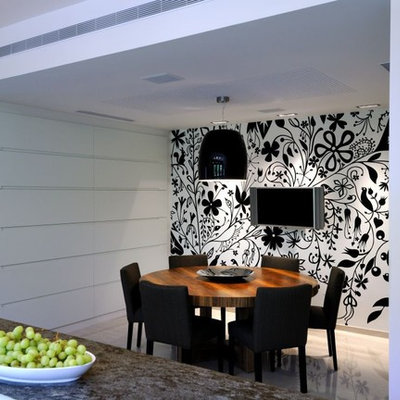 Trendy medium tone wood floor kitchen/dining room combo photo in Other