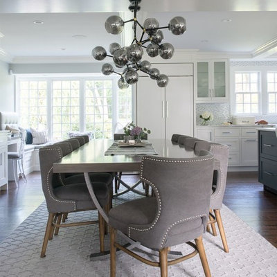 Example of a mid-sized transitional dark wood floor and brown floor great room design in DC Metro with gray walls and no fireplace