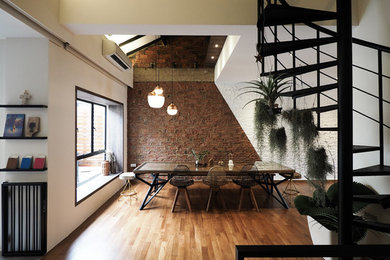 Dining room - mid-sized contemporary medium tone wood floor dining room idea in Singapore