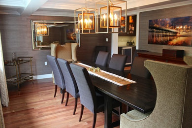Photo of a large contemporary enclosed dining room in Los Angeles with brown walls and light hardwood flooring.