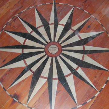 Housefox Design - Compass Rose. Black and Beige paint on original wood floors.
