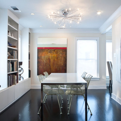 Inspiration for a small contemporary dark wood floor and brown floor enclosed dining room remodel in Atlanta with beige walls and no fireplace